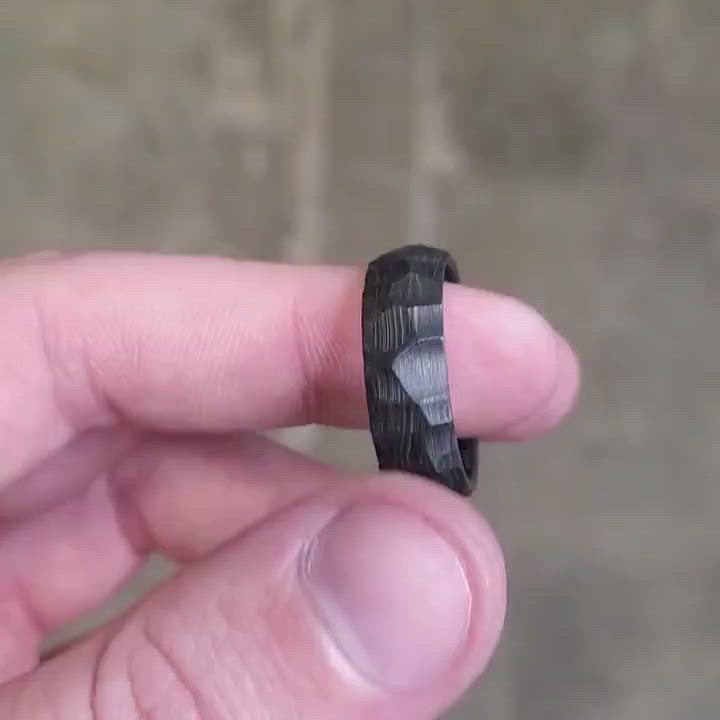 Hammered carbon fiber men's ring.