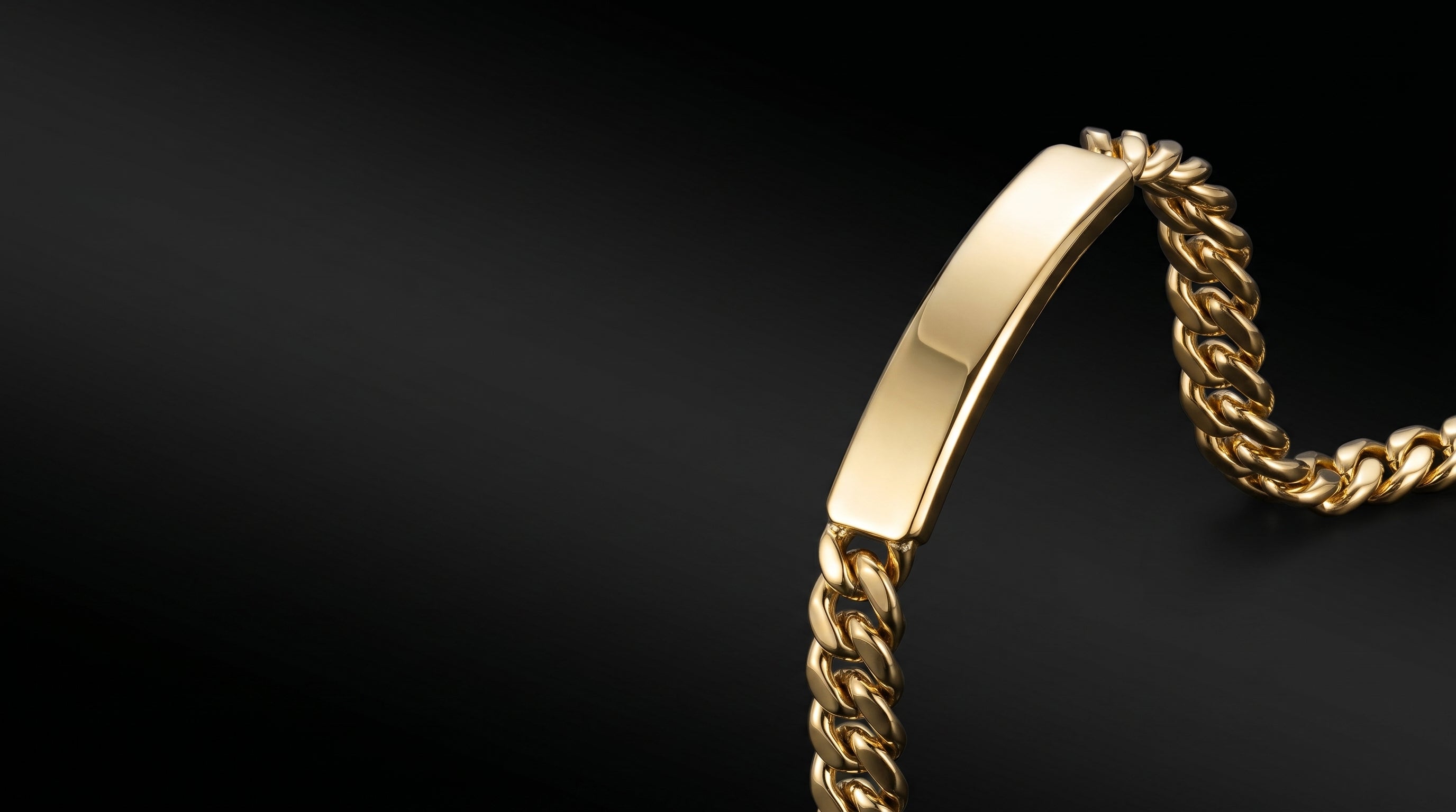 Gold-tone and silver men's chains, bracelets, and pendants arranged for a 3-piece order