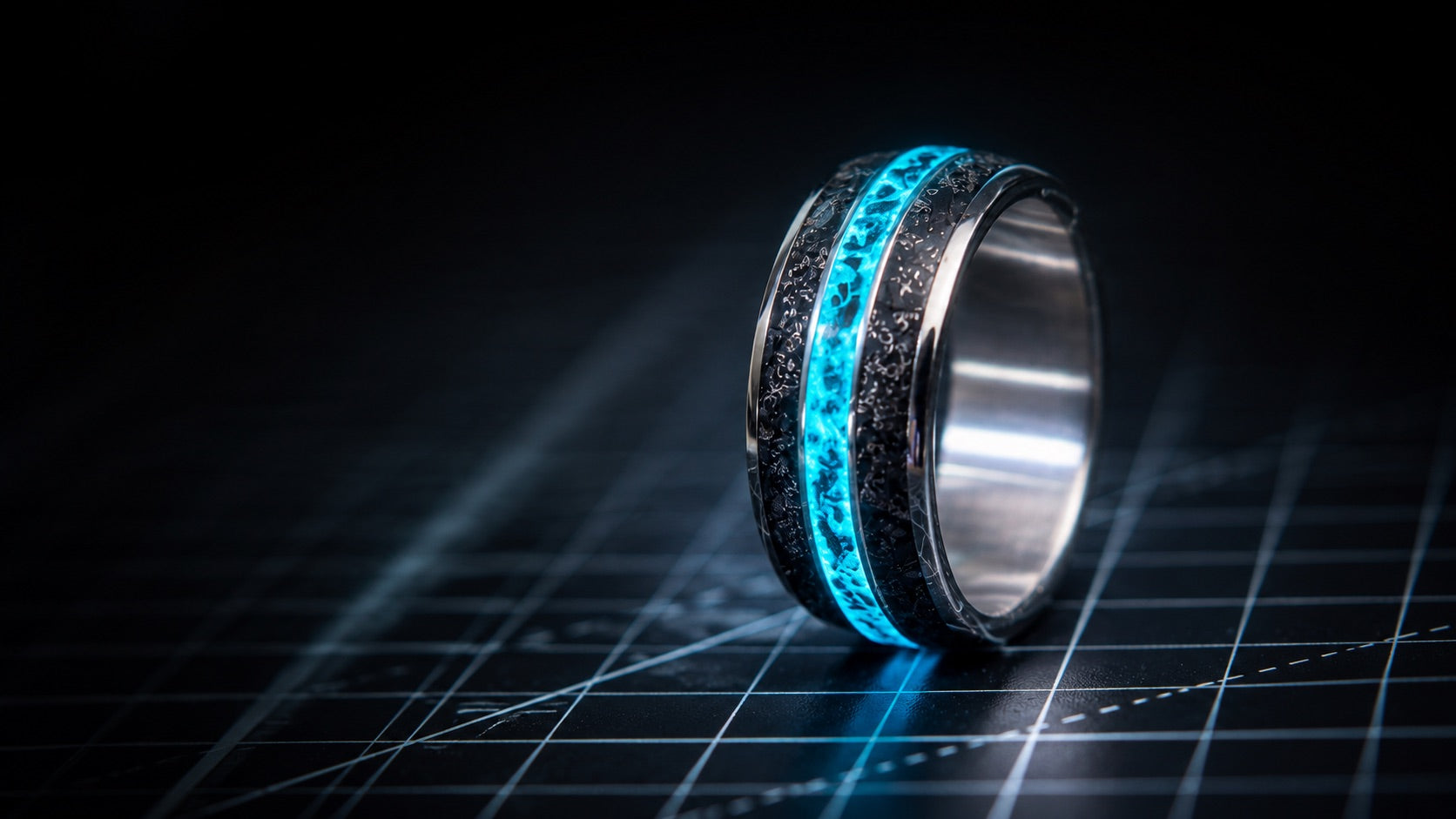 Terra Fortuna ring on a dark work surface