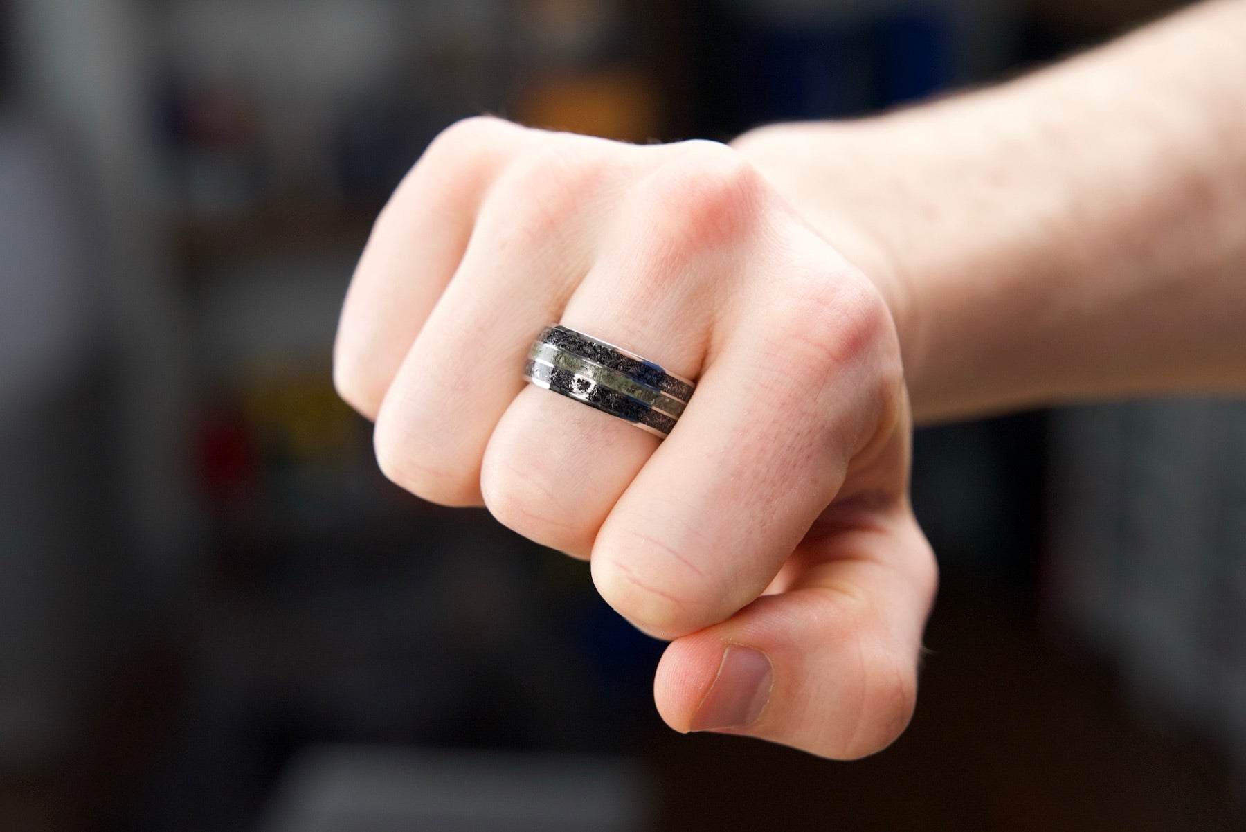 Terra Fortuna ring worn on a hand